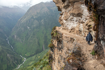 Young hiker man trekking with backpack in Peruvian Andes mountains, Peru, South America