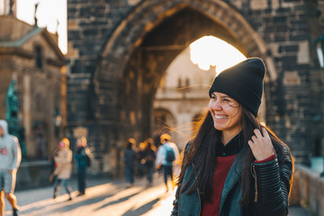 woman portrait at sunrise at charles bridge in prague