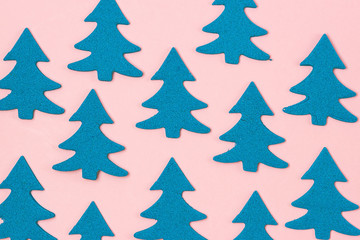 Blue Christmas Tree on Light Pink Background Top View Flat Lay Christmas Card or Background Minumal Concept Holiday Concept