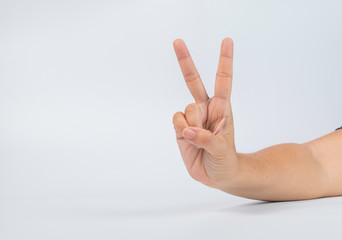 Middle age woman show 2 fingers v shape victory sign on white background