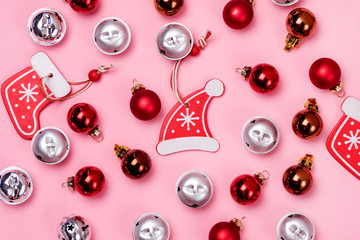 New Year Christmas Creative Background with Red and Silver Brown Christmas Balls on Pink Background Christmas Flat Lay Top View Festive Holiday Card or Background Pattern