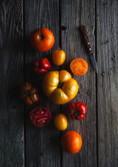 Ripe red tomatoes on a wooden background, healthy food, vegetables
