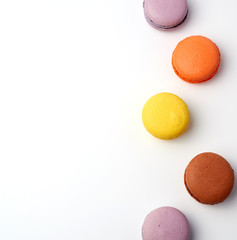 stack of colorful baked macaron almond flour on a white background