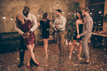 Full length photo of charming couple dance and fellows play sing in karaoke enjoy christmas party...