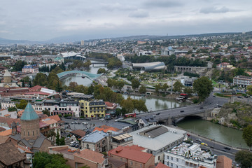 Fototapeta na wymiar View of the Tbilisi Cityscape along the Mtkvari River in Georgia