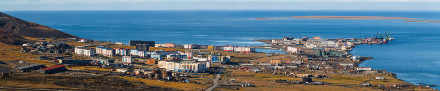 Panorama of the polar port town of Pevek. Pevek is the northernmost city in Russia. The coast of the East Siberian Sea of ​​the Arctic Ocean. Chukotka, Polar Siberia, Russian Far East. Russian Arctic.