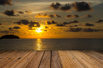Fototapeta na wymiar sunset on beach and wood for something drop