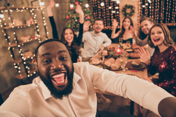Self-portrait of nice attractive handsome beautiful lovely smart stylish cheerful cheery funky excited ladies gentlemen guys having fun eve noel tradition spending enjoying leisure in decorated house