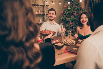 Portrait of nice-looking attractive glamorous smart stylish cheerful cheery guys spending leisure having fun sharing tasty yummy delicious homemade snack delicacy in house indoors