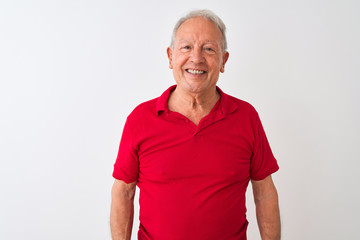 Senior grey-haired man wearing red polo standing over isolated white background with a happy and cool smile on face. Lucky person.