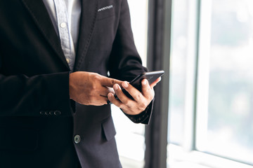 Business people using smart phones to work in the office