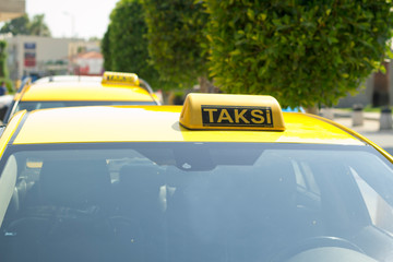 Taxi in Turkey. Yellow taxi color on the roof of the car sign.