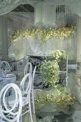 wedding dinning tables set up for dinning, decoration of white flowers, grey colour table cloth, elegant wedding 