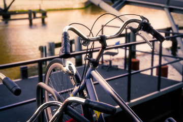 Bicycle parking with old and new bicycles, sunny day outside Amsterdam view.