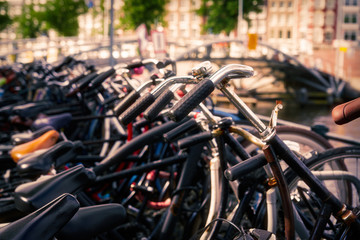 Fototapeta na wymiar Bicycle parking with old and new bicycles, sunny day outside