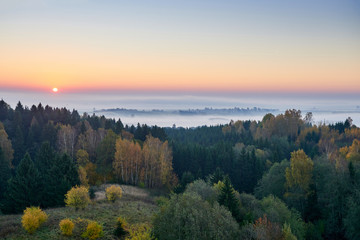 Morning landspace with sun rays. Beautiful landscape with forest and fog.Lithuanian landscape.