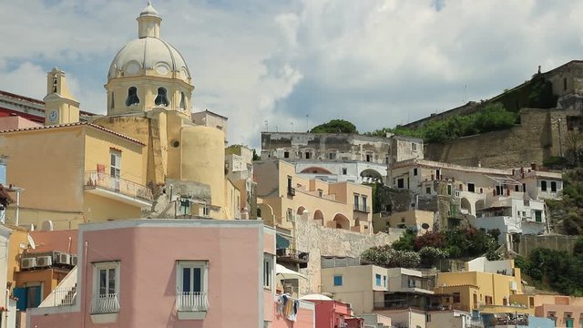 Village of Marina Corricella, Procida Island, Mediterranean Sea, near Naples. Church and the characteristic houses with colored facades.