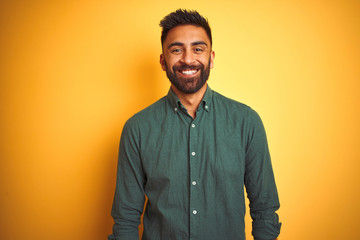 Young indian businessman wearing elegant shirt standing over isolated white background with a happy and cool smile on face. Lucky person.