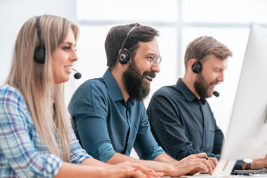 employees of the business center in the accessories sitting at the Desk