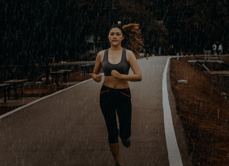 Asian woman look smart and healthy exercise outdoor in morning time