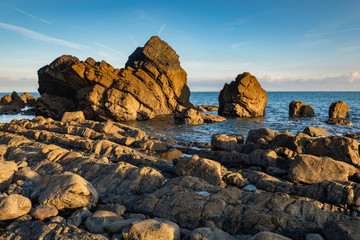 View of Rocks at Mouthmill Beach, North Devon, England at sunrise