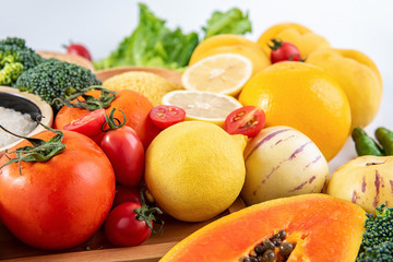 Fototapeta na wymiar Bunch of fresh seasonal fruits, vegetables and grains of legumes on a white background