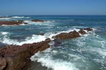 Fototapeta na wymiar Sea waves crash against the rocks in Antofagasta, Chile.