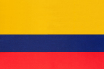 Colombia national fabric flag textile background. Symbol of international world south America country.
