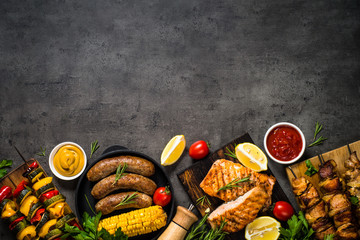 Barbeque dish - Grilled meat, fish, sausages and vegetables.