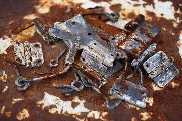 Scrap metal, old rusty door fasteners.