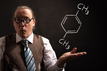 Professor presenting handdrawn chemical formula of Xylene
