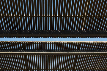 Backlit framed wooden fence on the roof