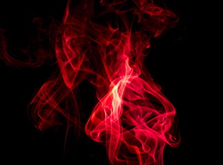 Red smoke on black background