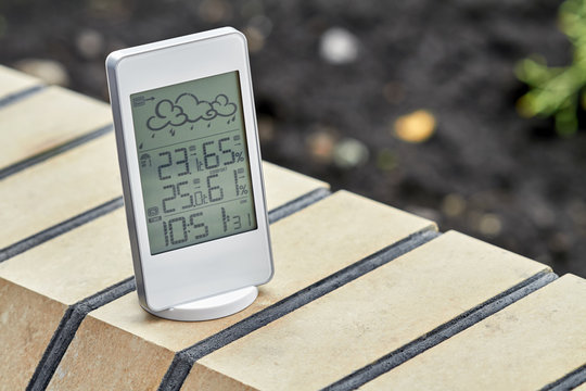 Best personal weather station device with weather conditions inside and outside. Home digital weather forecast concept with temperature and humidity.