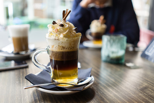 Close up of cup of irish coffee with cream at restaurant