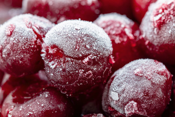 Ripe frozen red and maroon sweet cherries with hoarfrost. Natural organic healthy food. Closeup, selective focus