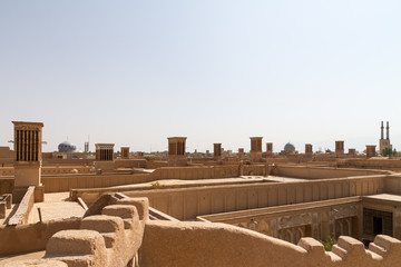 City skyline of desert town Yazd, Iran, since 2017 a World Heritage Site by UNESCO. Note the typical adobe (mudbrick) architecture and Badgir windtowers providing natural ventilation.