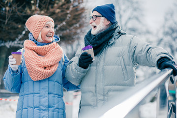 Aged people laughing at the funny joke while walking