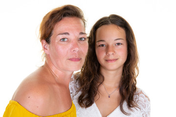 happy smiling mother posing teenager daughter in white wall background