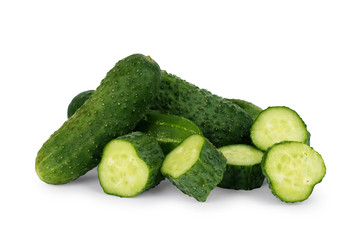 Whole and sliced fresh cucumbers on white background