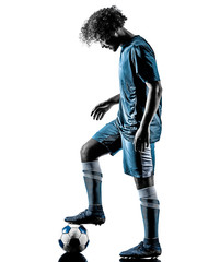 Fototapeta na wymiar one mixed race young teenager soccer player man playing in silhouette isolated on white background