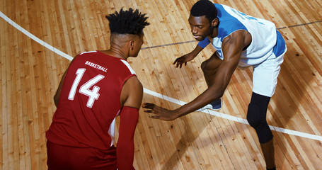 Professional basketball player in action on a sports arena