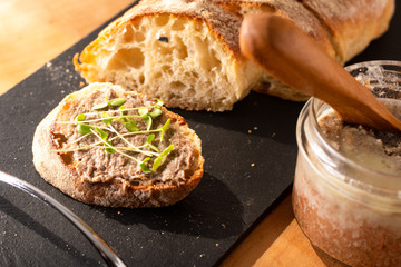 Food Concept french beefs Rillettes  spread on homemade crusty artisan ciabatta bread with flax...