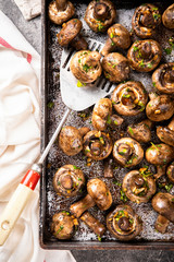 Baked champignons. Mushrooms in sauce. Hot appetizer. Fried vegetables.