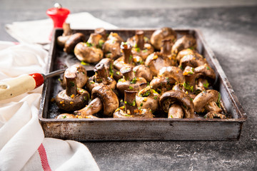 Baked champignons. Mushrooms in sauce. Hot appetizer. Fried vegetables.