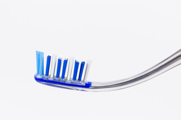 Toothbrush and tongue scraper