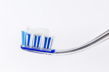 Toothbrush and tongue scraper