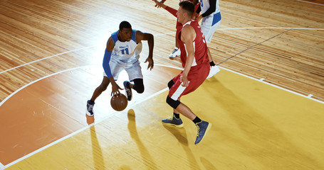 Professional basketball player in action on a sports arena