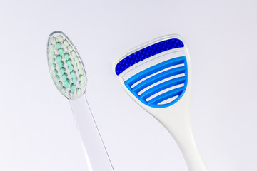 Toothbrush and tongue scraper