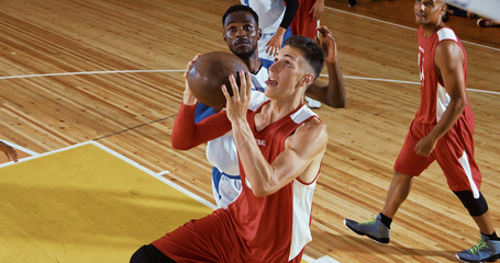 Professional basketball player in action on a sports arena